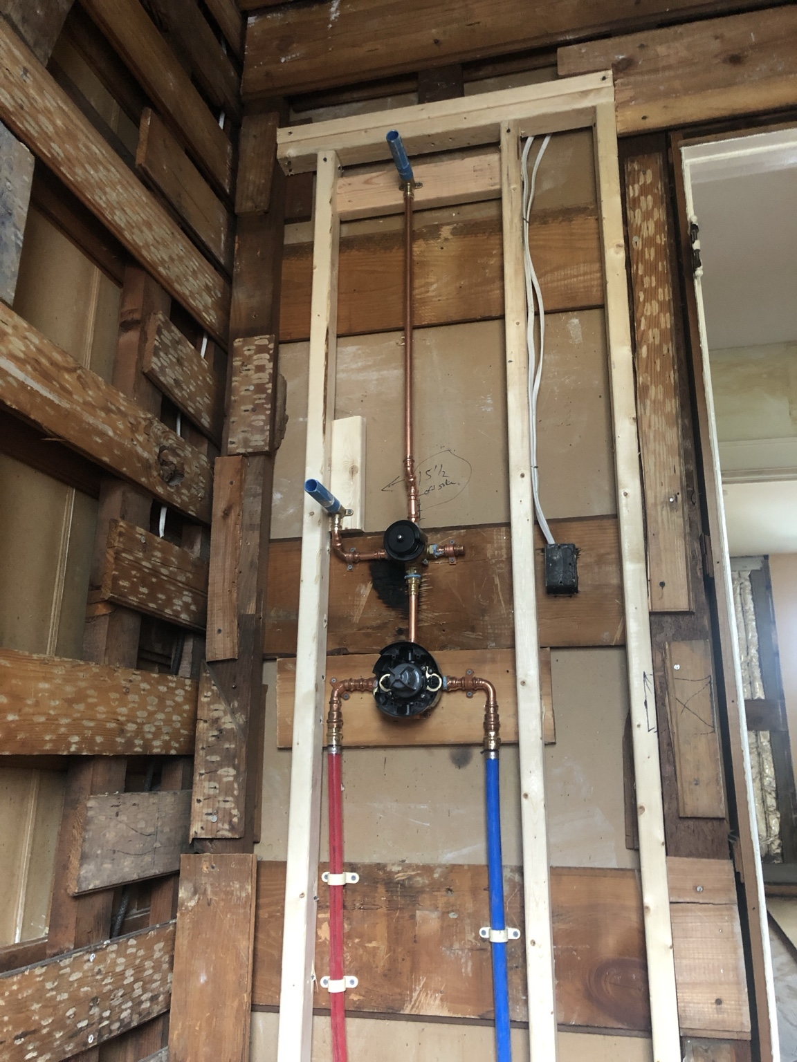 Shower valve and water piping during a Rutherford job. Shown as workmanship detail, not an offer of full bathroom remodeling.